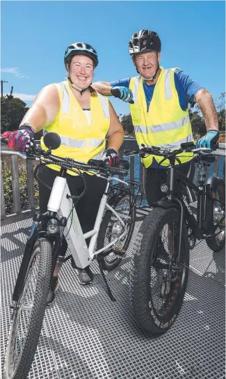  ??  ?? Karen Jackson and Scott Griffiths have started Marion Bay E-Bike Tours, looking to bounce back after losing their houses in the 2013 Dunalley fires and their jobs to the pandemic. Picture: Zak Simmonds