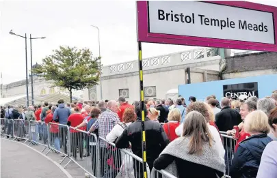  ??  ?? > Queues of sports fans waiting for trains outside Cardiff Central station is a common sight on match days