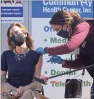  ?? H John Voorhees III / Hearst Conn. Media ?? Lt. Gov. Susan Bysiewicz receives her second dose of COVID-19 vaccine from registered nurse Leonela Espinal at the Community Health Center’s mass vaccinatio­n clinic April 5 at the Danbury Fair mall.