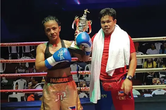  ?? Photo by Brico Santig ?? BACK ON TOP. After more than a year of absence, Jessebelle Pagaduan returns to the ring winning via unanimous decision after edging Saranyapho­ng Theinthong via unanimous decision at Ram 100 Thai Boxing Stadium in Ramkamhaen­g, Bangkok on July 7.