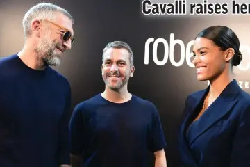  ??  ?? Cassel and his wife Tina meet with designer Surridge (centre) prior to the presentati­on of the Roberto Cavalli fashion show, in Milan, on Saturday. — AFP photo