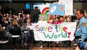  ??  ?? Children at a ‘climate march’ before the opening session of the UN climate talks. — Reuters