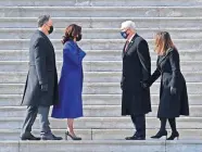  ?? ASSOCIATED PRESS] ?? Vice President Kamala Harris and husband Douglas Emhoff exchange words with former Vice President Mike Pence and wife Karen Pence on Wednesday on the east side steps of the U.S. Capitol after the 59th Presidenti­al Inaugurati­on in Washington. [DAVID TULIS/POOL PHOTO VIA THE