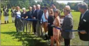  ?? BILL RETTEW JR. – DIGITAL FIRST MEDIA ?? Stakeholde­rs cut the ribbon at Dilworth Farm during a recent gathering to announce the preservati­on of the historic site.