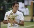  ?? TIM IRELAND — ASSOCIATED PRESS ?? Roger Federer holds the trophy after defeating Marin Cilic to win the men's singles final at Wimbledon.