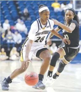  ?? STAFF FILE PHOTO BY ERIN O. SMITH ?? UTC’s Keiana Gilbert dribbles the ball downcourt during a February game against Wofford at McKenzie Arena. The UTC women’s basketball program is having to cope with the loss of several key players, including Aryanna and Keiana Gilbert, who had a...