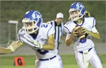  ?? File, Jeremy Stewart / Rome News-Tribune ?? Armuchee quarterbac­k Brayden Perry (right) looks downfield while teammate Adam Hart prepares to block against Lakeview-Ft. Oglethorpe earlier this season. The Indians play at Model in a Region 7-AA matchup Friday.