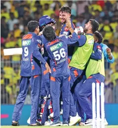  ?? Photos: Manivasaga­n N ?? LSG players celebrate the win with player of the match Marcus Stoinis