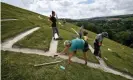  ?? Photograph: Ben Birchall/PA ?? Volunteers rechalking the Cerne Giant’s ribs on 28 August 2019.