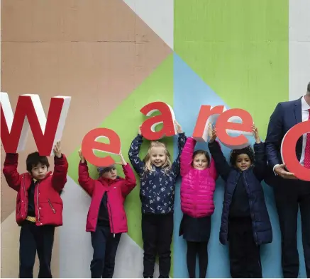  ??  ?? Proud: Tánaiste Simon Coveney had help from pupils from St Marie’s of the Isle school in Cork city to launch ‘We are Cork’, a new branding exercise to market the city and county. PHOTO: CLARE KEOGH
