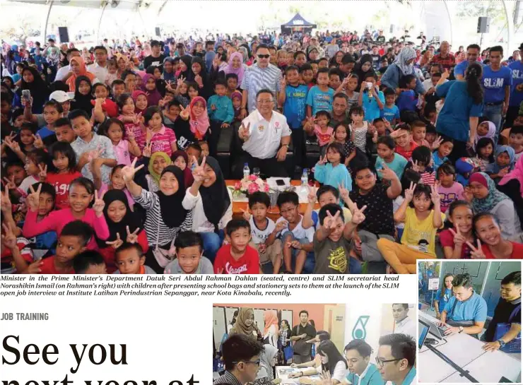  ??  ?? Minister in the Prime Minister’s Department Datuk Seri Abdul Rahman Dahlan (seated, centre) and SL1M secretaria­t head Norashikin Ismail (on Rahman’s right) with children after presenting school bags and stationery sets to them at the launch of the SL1M...