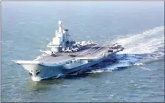  ?? AFP ?? This photo taken on December 24, 2016, shows the China’s only aircraft carrier, sailing during military drills in the Pacific.