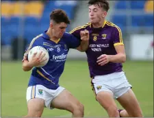  ??  ?? Wicklow’s Sam kearney collides with Wexford’s Tom Kavanagh.