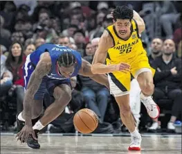  ?? William Liang Associated Press ?? PACERS guard Ben Sheppard (26) chases after a loose ball after Clippers forward Kawhi Leonard lost control in the second half of Indiana’s victory on Monday.