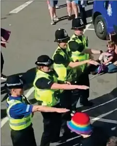  ?? ?? ON THE BEAT: Police officers performing the macarena dance at the Pride parade in Lincoln last week