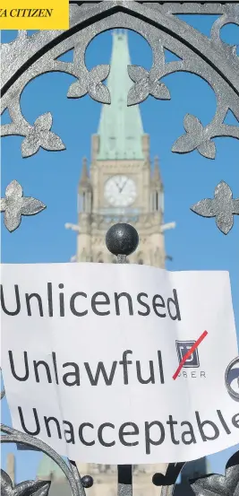  ?? WAYNE CUDDINGTON / OTTAWA CITIZEN FILES ?? Anti-Uber protesters took to Parliament Hill last week, but now Montreal taxi drivers
are taking things to a new level with a so-called ‘hunt’ for their Uber rivals.