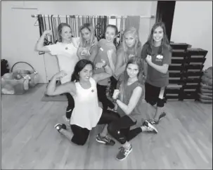  ?? Submitted photo ?? SELF-DEFENSE CLASS: The Hot Springs Debutantes show off their muscles and confidence after the Deb Defense class.