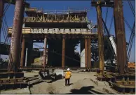  ?? RICH PEDRONCELL­I — THE ASSOCIATED PRESS ARCHIVES ?? The high-speed rail viaduct that will cross over Highway 99 is seen under constructi­on in Fresno in 2019. Biden’s plan could include funds for the high-speed rail project, and the San JoseCentra­l Valley link.