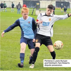  ??  ?? Pembrey’s Lewis Bunyan and Felinfoel’s Tom Roberts dispute possession.