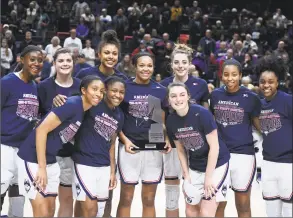  ?? Jessica Hill / Associated Press ?? The UConn’s women’s basketball team poses with the American Athletic Conference trophy after a win over Houston on March 2 in Storrs.