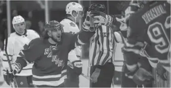  ?? SETH WENIG/AP ?? Leaf killer Mats Zuccarello celebrates at the Rangers bench after scoring the game-winner in the final minute.