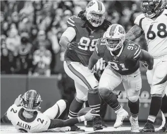  ?? John Munson / Associated Press ?? Bills rookie Ed Oliver (91) is fired up after sacking the Broncos’ Brandon Allen as part of a strong second half to the season.