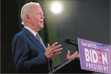  ?? SUSAN WALSH/AP PHOTO ?? Democratic presidenti­al candidate, former Vice President Joe Biden speaks Friday during an event in Dover, Del. Biden has won the last few delegates he needed to clinch the Democratic nomination for president.