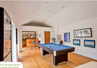  ??  ?? The outbuildin­g features a games room and bar