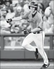  ?? Mike Theiler
Associated Press ?? PAVIN SMITH of Virginia runs the bases after hitting a two- run home run in the fourth inning.