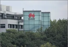  ?? MATT DUNHAM — THE ASSOCIATED PRESS ?? A Huawei sign is displayed on the company’s premises in Reading, England, Tuesday.