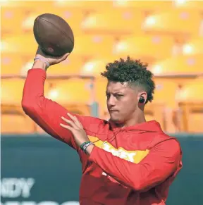  ??  ?? Chiefs quarterbac­k Patrick Mahomes warms up before a game against the Steelers on Sunday in Pittsburgh. CHARLES LECLAIRE/USA TODAY