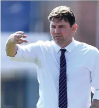  ??  ?? STALEMATE: Tom Conlon patrols midfield, while, above, Carlisle boss Chris Beech issues instructio­ns.