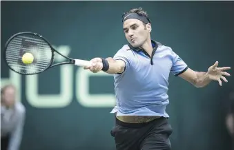  ?? — GETTY IMAGES ?? Roger Federer plays a forehand during his semifinal win over Russia’s Karen Khachanov of Russia at the Gerry Weber Open.