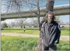  ?? PHOTO BY GABRIEL GRESCHLER ?? Dewayne Picquette stands near the entrance of a homeless encampment in Concord on San Miguel Road on Sunday. Police say all 25 individual­s at the site must leave by Wednesday.