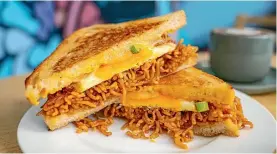  ??  ?? If there’s one thing you shouldn’t leave Sydney without trying, it’s the Mi Goreng Toastie at Dutch Smuggler.