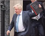  ?? Dan Kitwood/getty Images North America/tns ?? British Prime Minister, Boris Johnson departs No.10 Downing street for the Houses of Parliament, on April 19, in London.