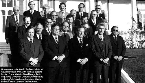  ??  ?? Government ministers in the Fourth Labour Government in 1984, with Michael Bassett behind Prime Minister David Lange (both in glasses), Governor-General David Beattie on Lange’s left, and now Auckland Mayor Phil Goff in the centre of the back row.