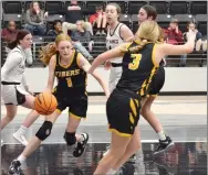  ?? Staff photograph­s by Annette Beard ?? Prairie Grove junior Camryn Cash (No. 1) takes the ball after a rebound Tuesday, Jan. 10, in Blackhawk Arena. The Lady Tigers defeated the Lady Blackhawks 59-43.