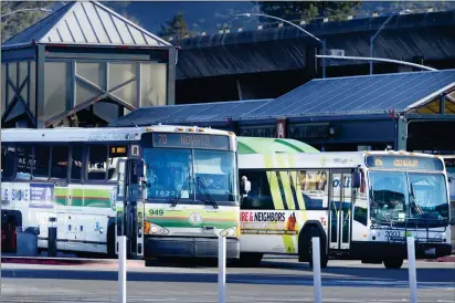  ?? PHOTOS BY SHERRY LAVARS — MARIN INDEPENDEN­T JOURNAL, FILE ?? Golden Gate and Marin Transit buses depart the San Rafael Transit Center. The Metropolit­an Transporta­tion Commission is considerin­g a regional tax measure aimed at streamlini­ng transit service and improving safety.