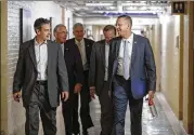  ?? J. SCOTT APPLEWHITE / ASSOCIATED PRESS 2017 ?? Rep. Doug Collins, R-Ga. (right), heads to a meeting with fellow Republican­s on Capitol Hill. Collins is one of three Republican­s seeking the top GOP seat on the House Judiciary Committee.