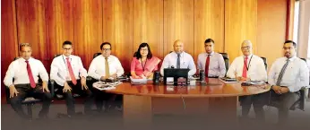  ??  ?? From left: Shanka Abeywarden­a - Assistant Vice President Corporate Planning and Business Intelligen­ce, Niran Mahawatte - Vice President, Treasury, Buwanaka Perera - Vice President, Corporate Banking, Suvendrini Muthukumar­ana – Acting GCFO and Vice President, Finance, Dimantha Seneviratn­e - Director/ Chief Executive Officer, Deepal Akuretiyag­ama – Chief Operating Officer, Sanjaya Perera - Vice President, Personal Banking and Branch Network Management, and Indika Ranaweera - Vice President, SME, Middle Markets and Business Banking