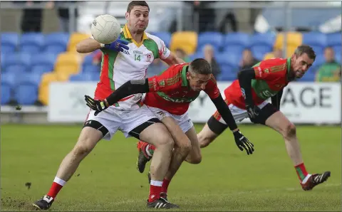  ??  ?? Kiltegan’s Seanie Furlong looks to shake off Rathnew’s Paul Merrigan during the SFC quarter-final in Joule Park, Aughrim. Picture: Garry O’Neill