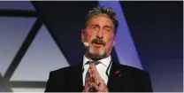  ?? (Darrin Zammit Lupi/Reuters) ?? JOHN MCAFEE addresses a conference in 2018.