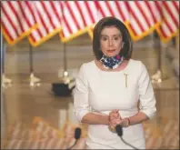  ?? The Associated Press ?? NANCY: House Speaker Nancy Pelosi of Calif., walks to speak about the so-called Heroes Act, Tuesday, on Capitol Hill in Washington.