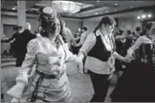  ??  ?? Gears in motion: Sonya Jew participat­es in a proper Victorian Ball dancing set at the Clockwork Alchemy ball.