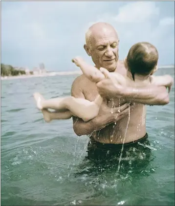  ??  ?? Robert Capa’s 1948 photos of Pablo Picasso playing with his son Claude in Vallauris, France, were rejected by a magazine in favour of the black-and-white versions.