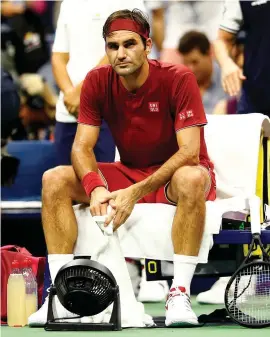  ?? GETTY IMAGES ?? A dejected Roger Federer following his defeat to John Milman