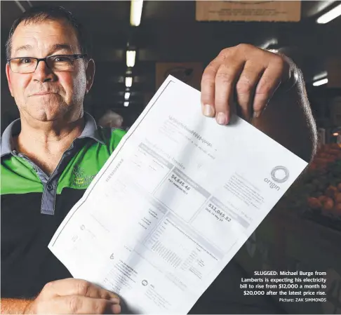  ?? SLUGGED: Michael Burge from Lamberts is expecting his electricit­y bill to rise from $ 12,000 a month to $ 20,000 after the latest price rise. Picture: ZAK SIMMONDS ??