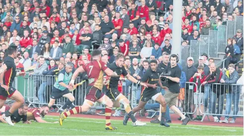  ??  ?? ● Tyler Morgan (all black strip) on his way to scoring a try for Wales in last Friday’s match against RGC at Parc Eirias, Colwyn Bay. Picture: Robert Parry Jones