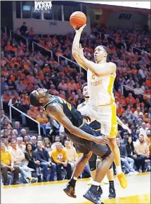  ??  ?? Tennessee forward Grant Williams (2) goes for a shot as he’s blocked by Missouri forward Jeremiah Tilmon (23) during the first half of an NCAA collegebas­ketball game on Feb 5, in Knoxville, Tennessee. (AP)